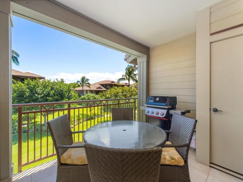 Relax and unwind on the spacious lanai featuring outdoor dining for four, a private BBQ grill, and peaceful garden views.