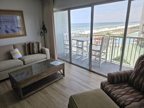 Step into your beachfront retreat and soak in stunning views of white sand and turquoise water from your private balcony. Relax with a book on the comfortable sofa or enjoy morning coffee while watching waves roll in.