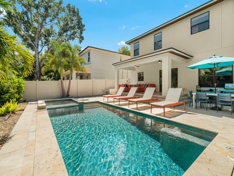 Your private oasis awaits—lounge poolside under swaying palms, soak up the sunshine, and unwind with outdoor dining steps from the sparkling water.