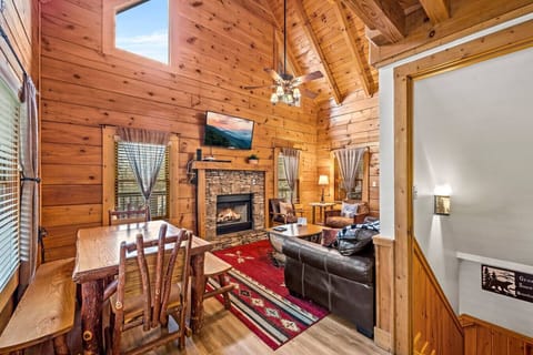 Inside the front door. The living area is immediately to your left and the kitchen to your right. The stairs lead to the lower level.