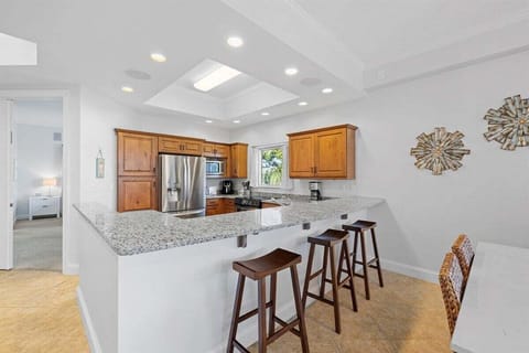 Bright kitchen space with casual bar seating.