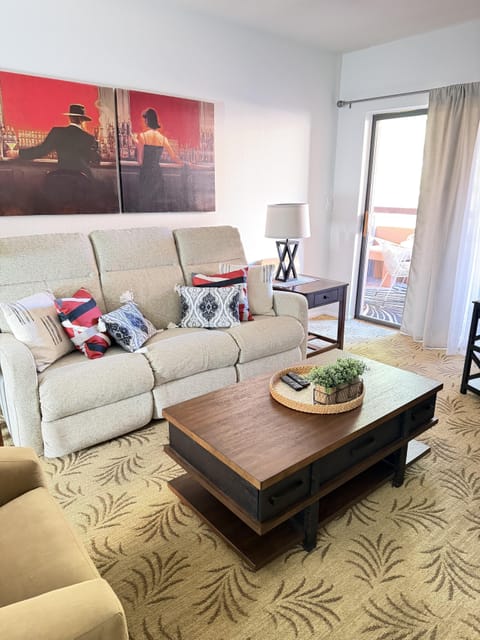 Cozy living room with plush seating and balcony access