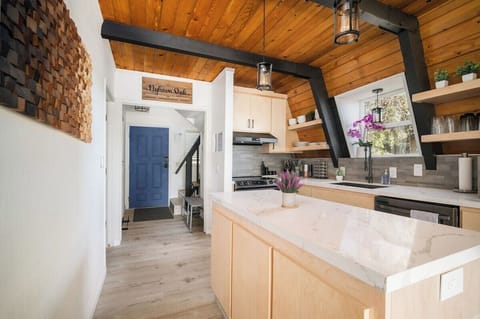 Kitchen island leading in from front door for additional space to serve or prep your family meal!