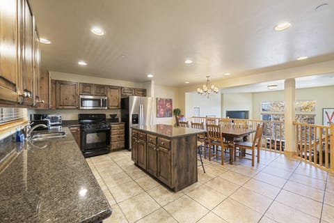 Well Stocked Open Kitchen and Seating for Eight at the Dining Table