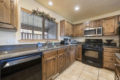 Kitchen with Plenty of Storage - Window Looking out to the Deck