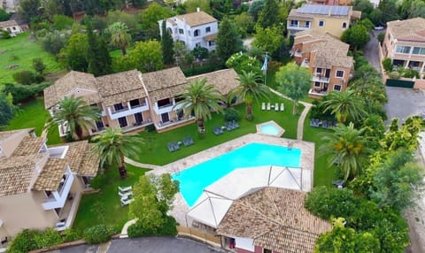 A large shared pool in the center of the resort, along with a pool-bar