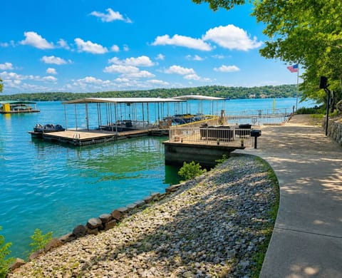 Stunning Lake of the Ozarks waterfront escape with private dock, panoramic lake views, and direct access to swimming, boating, and fishing adventures.