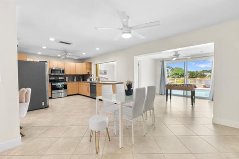 Open concept area featuring the dining, kitchen and foosball area