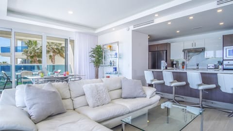 The full main open living room space including dining area and kirtchen.