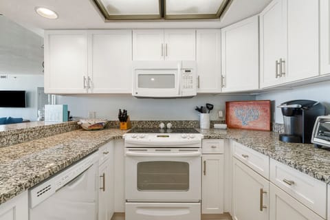 The kitchen is a sleek, functional space with modern appliances and ample storage.