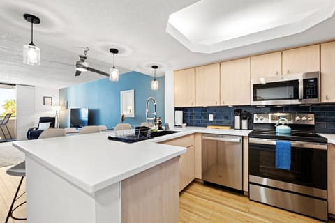 Kitchen, fully stocked with eating and cooking utensils