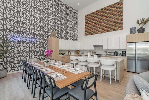 Main Level:  An expansive dining area with seating for 12, where luxury meets versatility, fostering quality time, cherished memories, and grand gatherings.