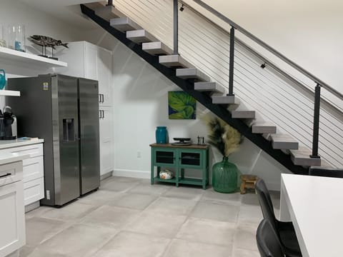 Stairs to 3 bedrooms, 2 full baths and living/den space 