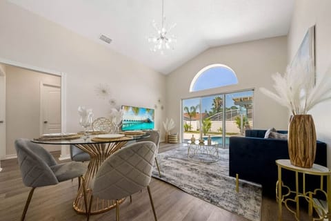 Living room with Pool View!#Disney #Parks #kingdom #springs #poolhouse #Vacation #Rental #waterpark #Kissimmee #Orlando #universal #citywalk #legoland #shortstay #longstay #bbq #grill #privatepool