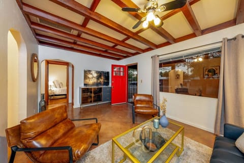 Living room with smart TV and view of Bedroom 2