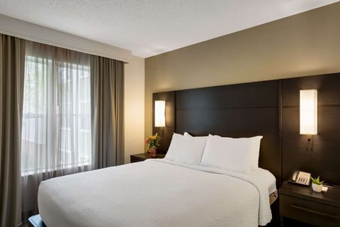 Drift off in a serene bedroom with airy natural light.