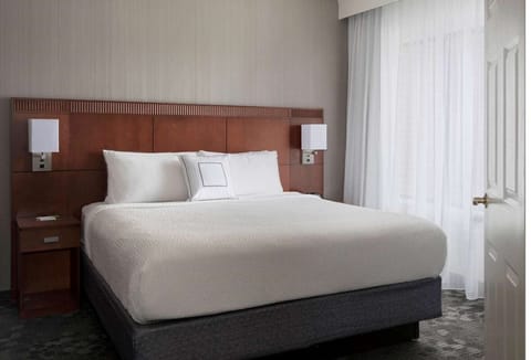 Drift off in a serene king room with hotel-soft bedding.