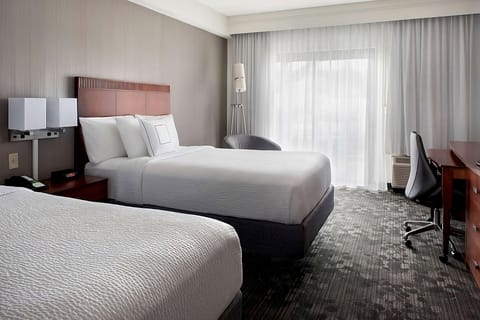 Sink into a dreamy bed with gentle daylight and quiet comfort.