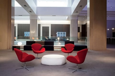 Gather in a stylish atrium lounge for a relaxed nightcap.