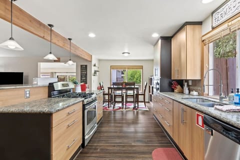 Fully stocked open concept kitchen to make your meals and still be a part of the group.