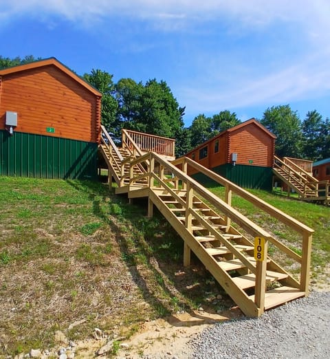 Name plate , number sign, & parking area (around the back of the cabin)