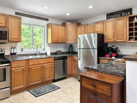 The fully stocked kitchen has everything you need for dining in.