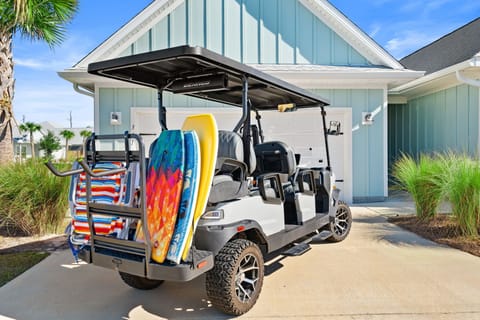 Your private golf cart awaits, complete with beach chairs and boogie boards for effortless trips to the shore.