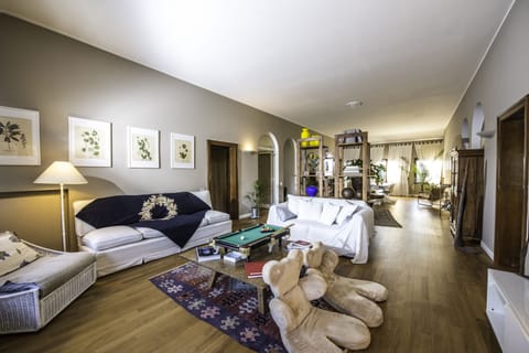 Spacious living room that connects all 3 rooms, there is also a kitchenette.