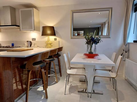 Large dining room table in the open plan kitchen / living room. 