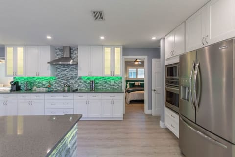 Discover the fully remodeled kitchen that features solid wood shaker cabinets, soft close doors and drawers, upgraded hardware, quartz countertops, beautiful glass backsplash and all new stainless steel appliances.