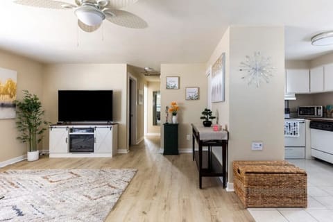 View from inside the front door - living room on left, kitchen & dining on right