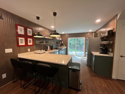 Newly renovated kitchen with all major appliance, utensils, pots and pans.
