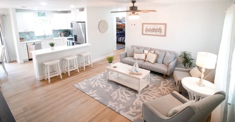 Our spacious & comfortable nautical-themed living room & fully-equipped kitchen