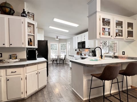 Open concept kitchen stocked with everything you could need for your vacation.