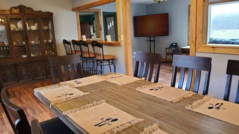 Table for 10. We have an additional 4 person folding table. Plenty of room for everyone in the dining room.