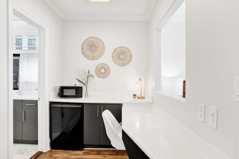 Bedroom 7 has a desk, microwave and mini fridge