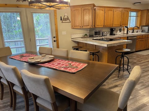 The dining area, off of the kitchen offers plenty of seating for large groups.