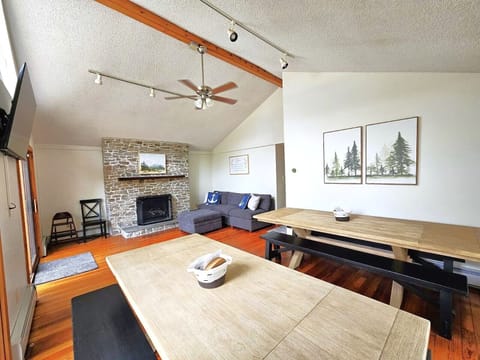 Great room with sofa and enough seats for 12 to dine