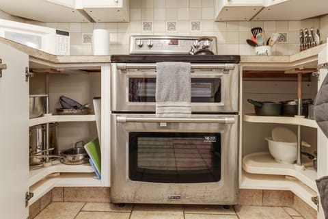 Fully stocked kitchen with pots and pans