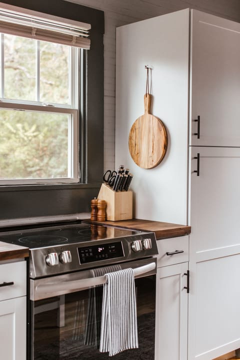 Brand new stainless steel appliances are installed throughout the kitchen. 