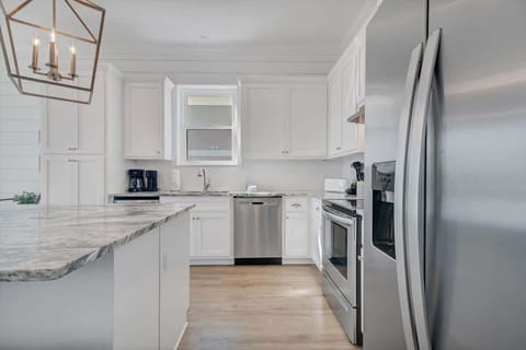 Chef's kitchen with granite countertops and stainless steel appliances