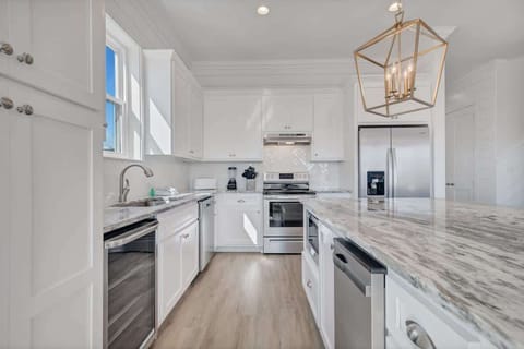 Chef's kitchen with granite countertops and stainless steel appliances