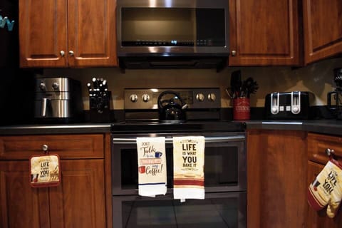 Fully stocked kitchen - equipped with dishwasher, microwave, coffee maker, tea kettle, pots and pans. (2)