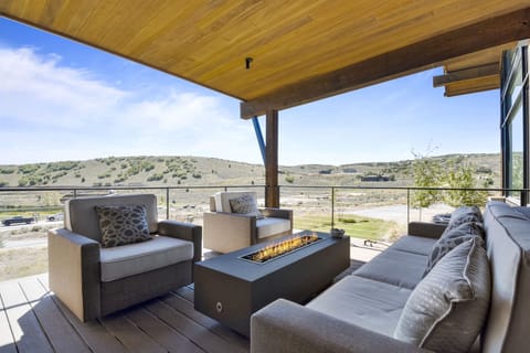 Outdoor living space with flatscreen TV.