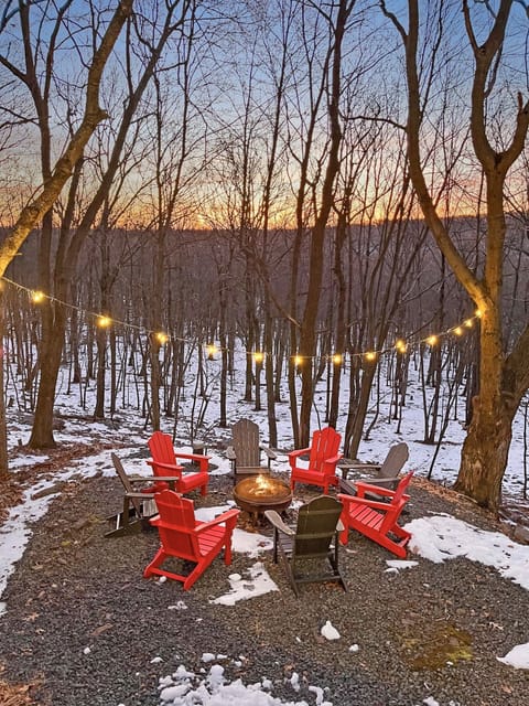 Embracing the cozy warmth of a Poconos campfire, right outside our mountain retreat.
