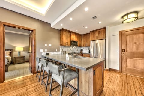 Open concept kitchen with modern stainless steel appliances