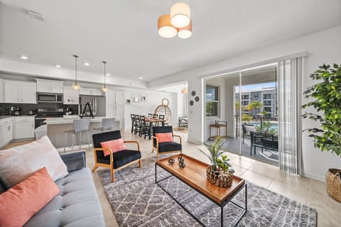 Living Room with Pool View#Disney #Parks #kingdom #springs #StoreyLake #resort #Apartment #Vacation #Rental #waterpark #Kissimmee #Orlando #universal #citywalk