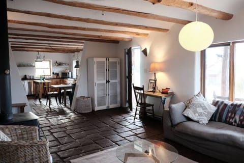 Games and supplies in cabinet, including an air mattress.