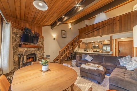 The loft with full bathroom is located up the stairs from the open living area.