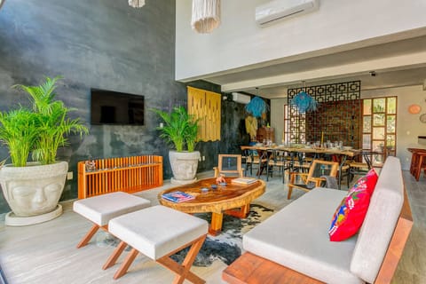 As you enter, you’re greeted by a luminous open living space